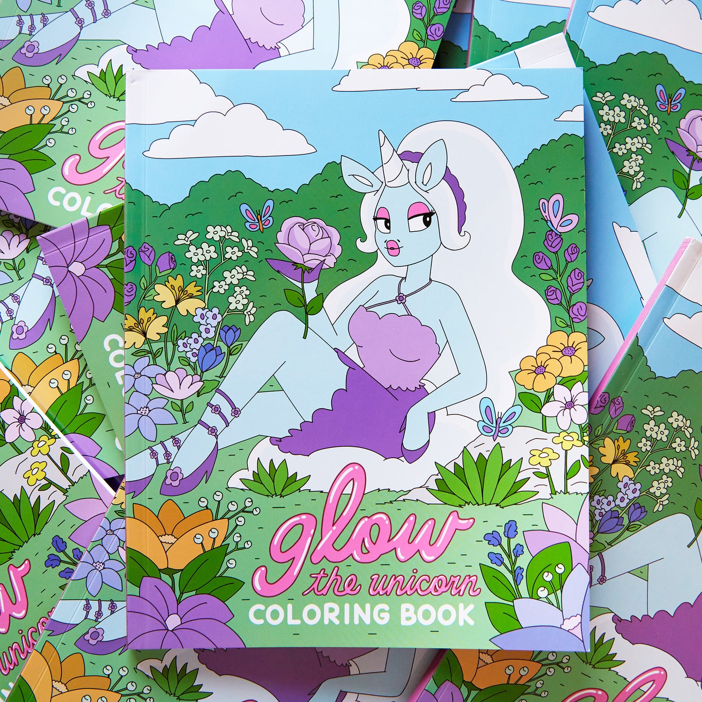 unicorn coloring book pile