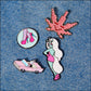 pins on jeans. glow the unicorn and other pins