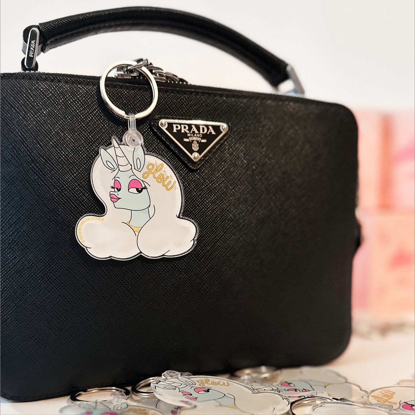 unicorn charm in prada bag